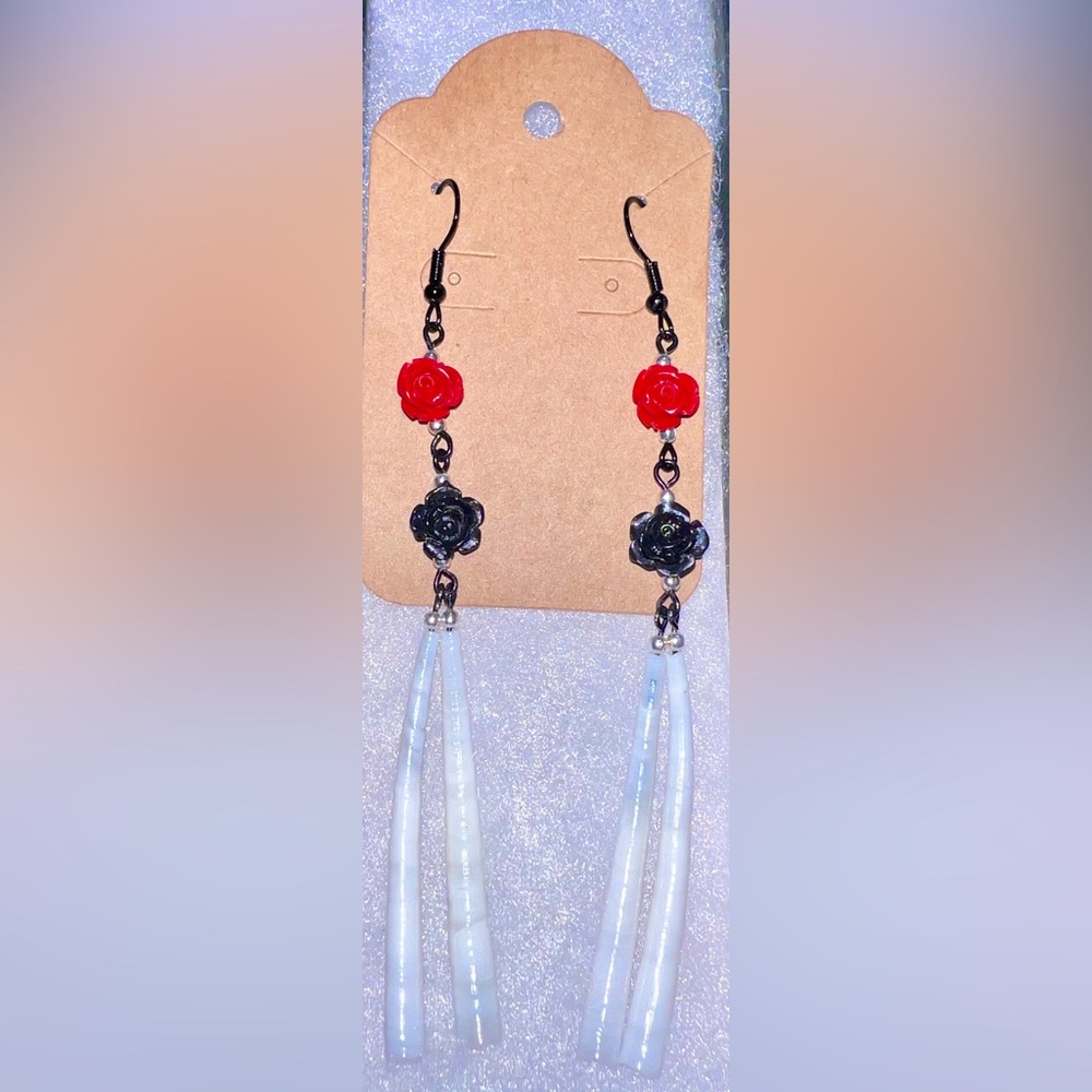 Handmade, detallium shells with black and red roses on black findings! Beautiful
